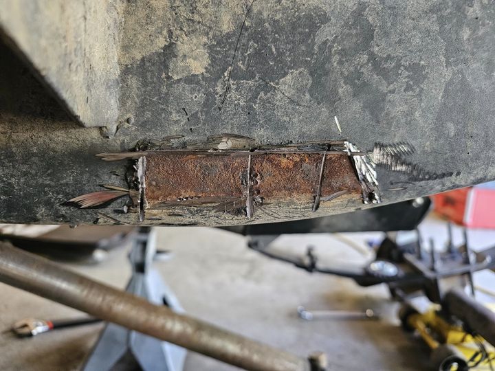 Front axle rear spring hanger rust pocket-Passenger Side.jpg